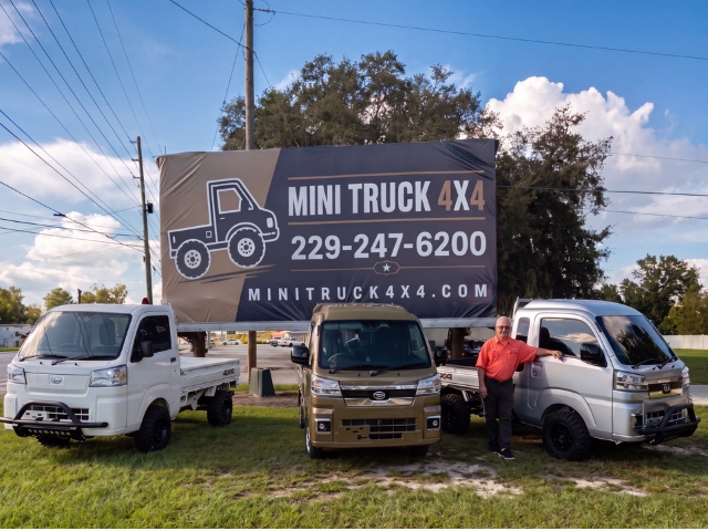 Kerry O'Steen owner of Mini Truck 4x4 with billboard and mini trucks